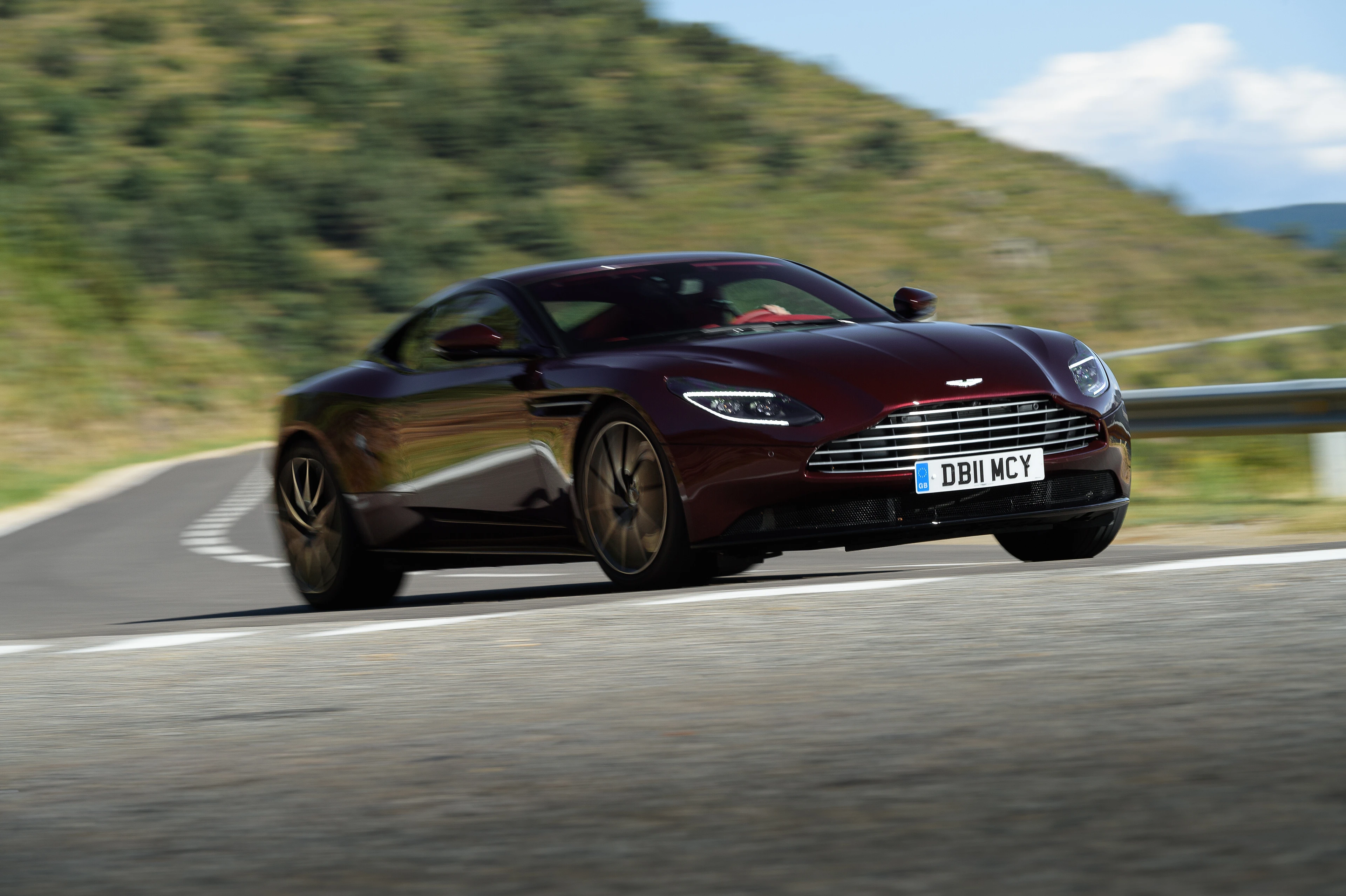 DB11 V8 in Divine Red on the Move