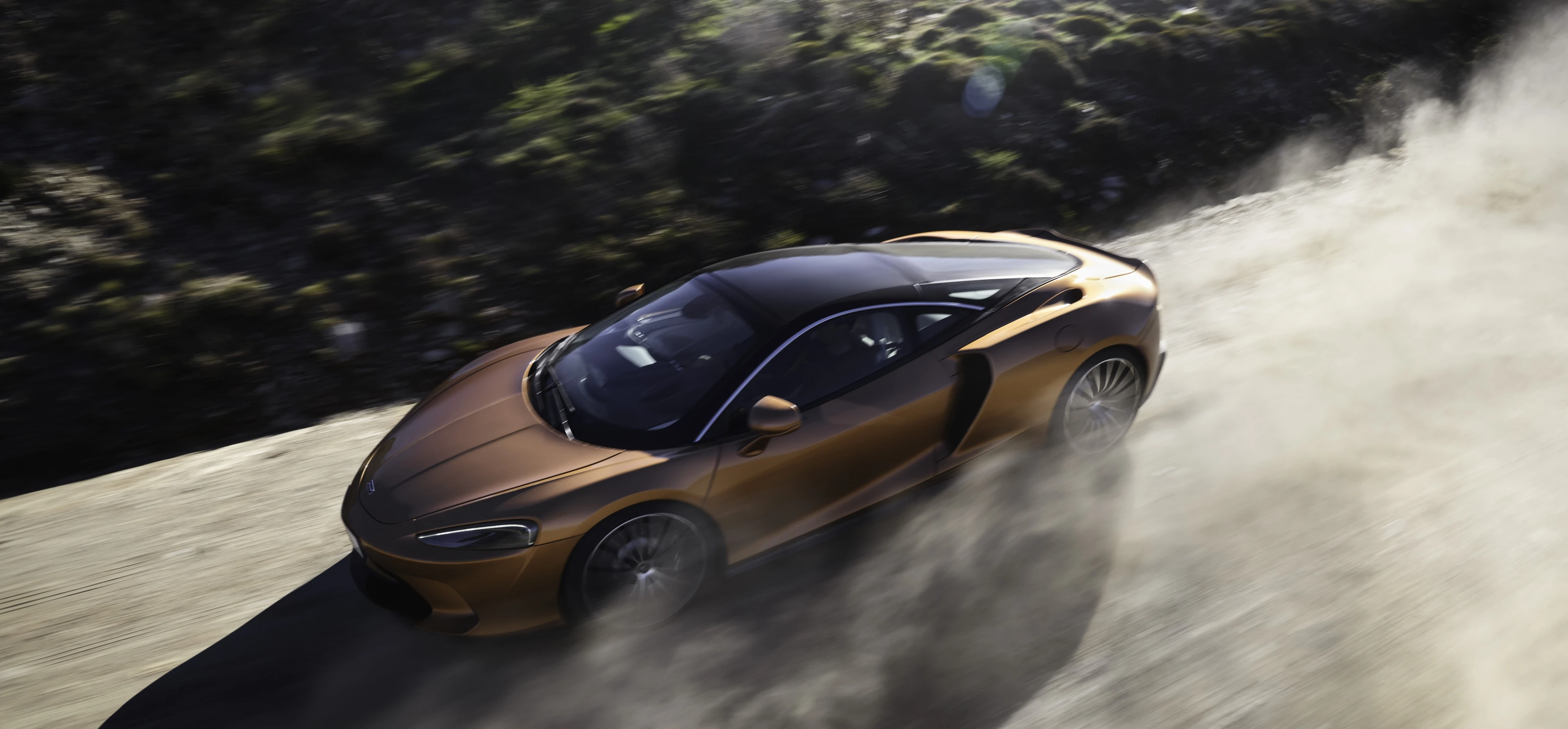 GT driving on a dusty road