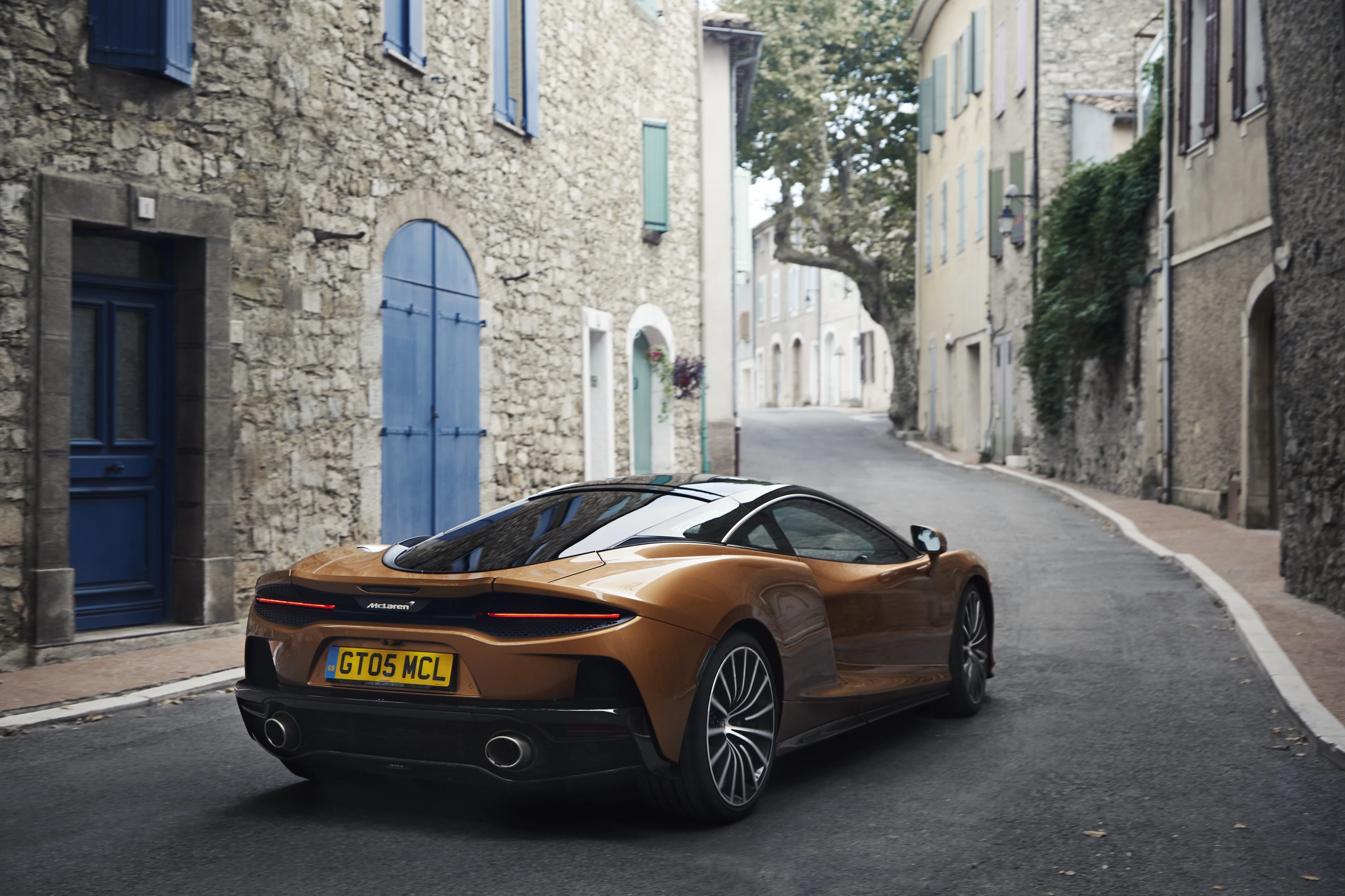 GT rear three-quarter in a village street